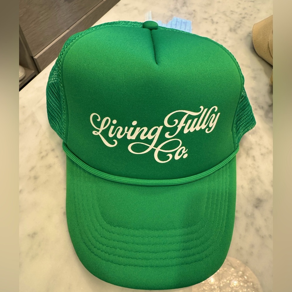 Living fully by Mallory Ervin green trucker hat
